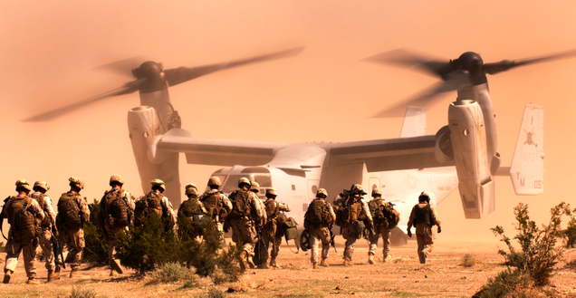 Marines and sailors from India Company, 3rd Battalion, 3rd Marine Regiment, make their way to a VMMT 365 MV-22 Osprey at Marine Corps Air Ground Combat Center Twentynine Palms, California (US Marine Corps)